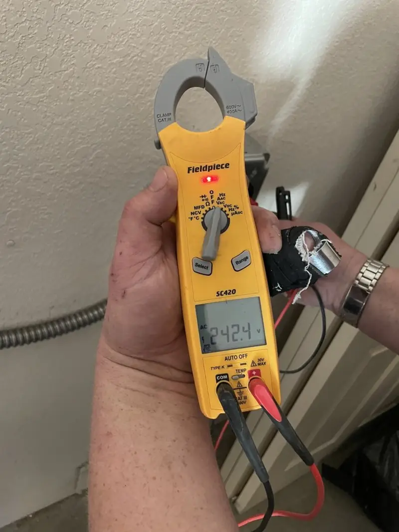 Voltage testing with clamp meter during Whole House Surge Protector in Clarksdale